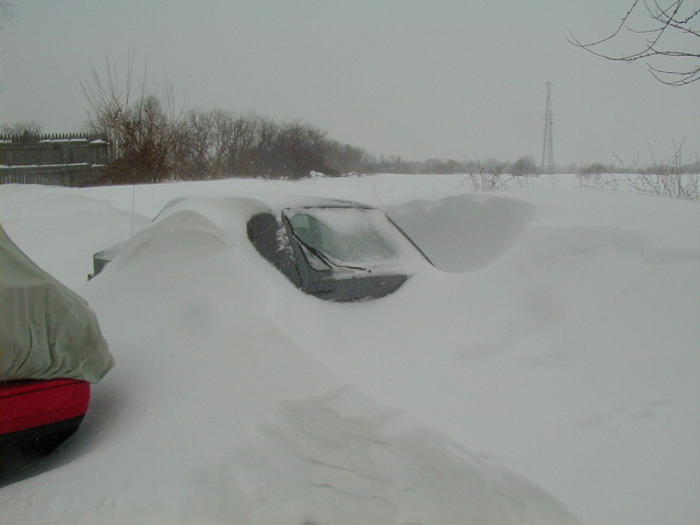 A picture of my VW Rabbit buried in snow